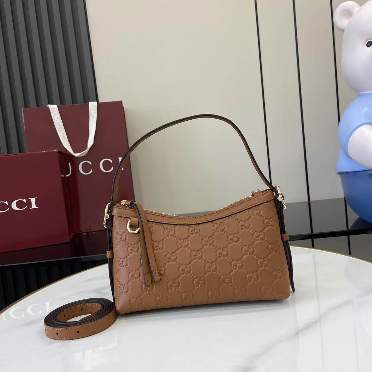 Gucci Emblem Embossed