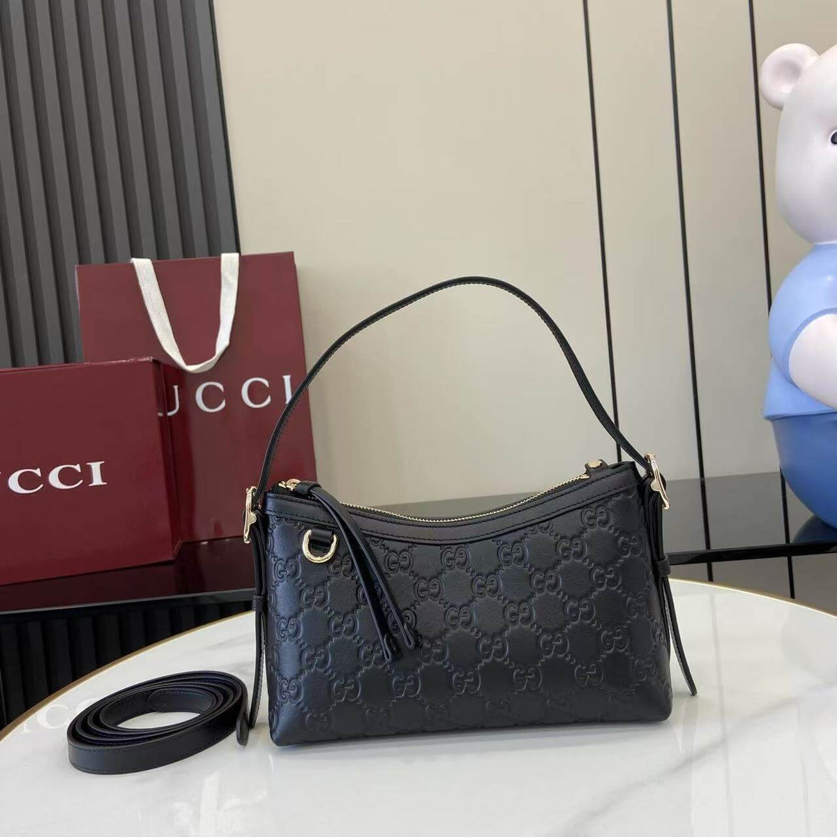 Gucci Emblem Embossed