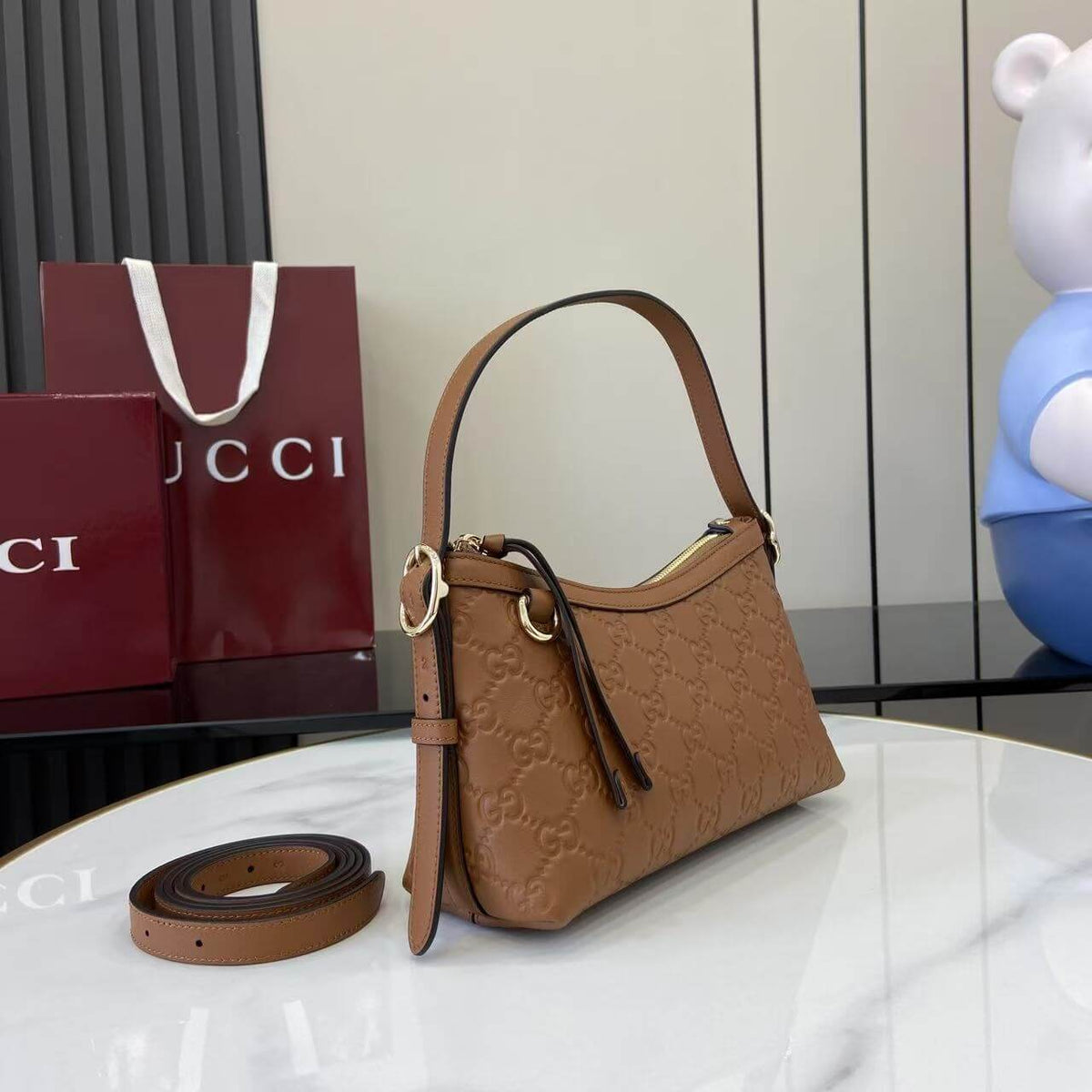 Gucci Emblem Embossed