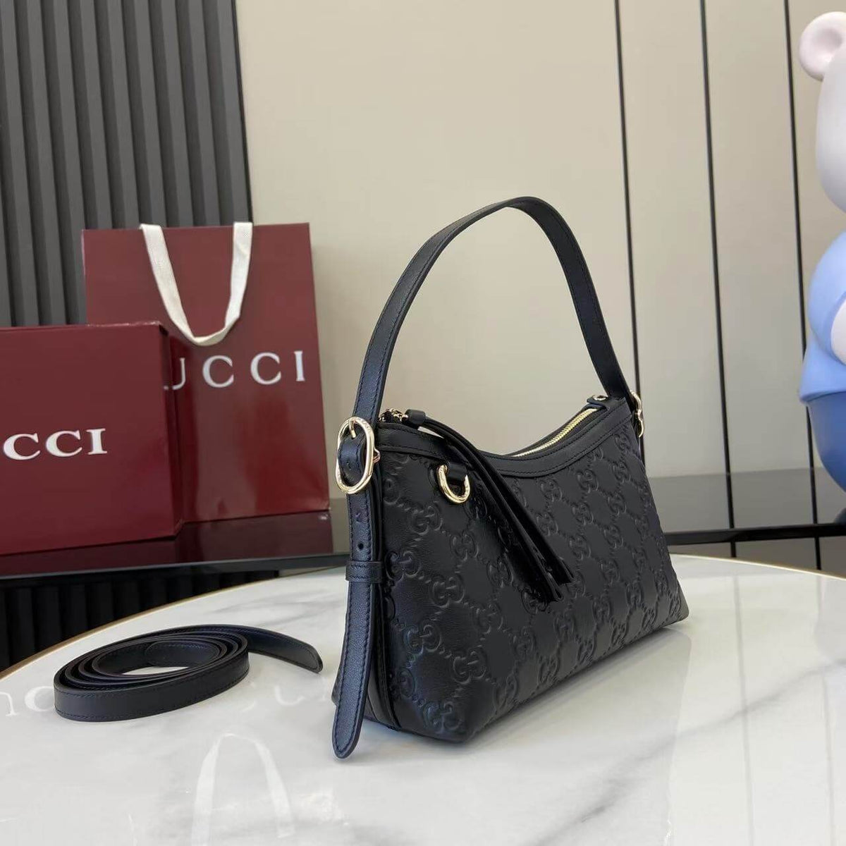 Gucci Emblem Embossed