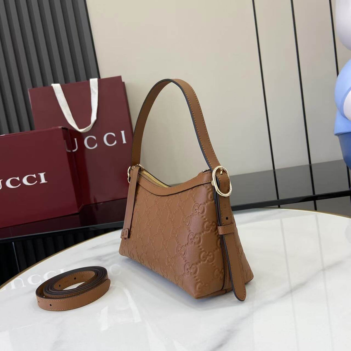 Gucci Emblem Embossed