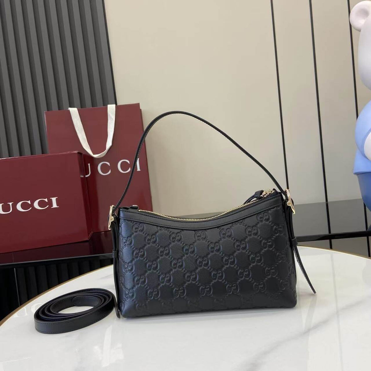 Gucci Emblem Embossed