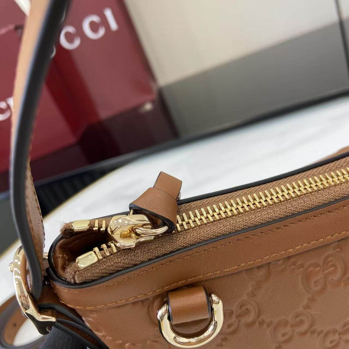 Gucci Emblem Embossed