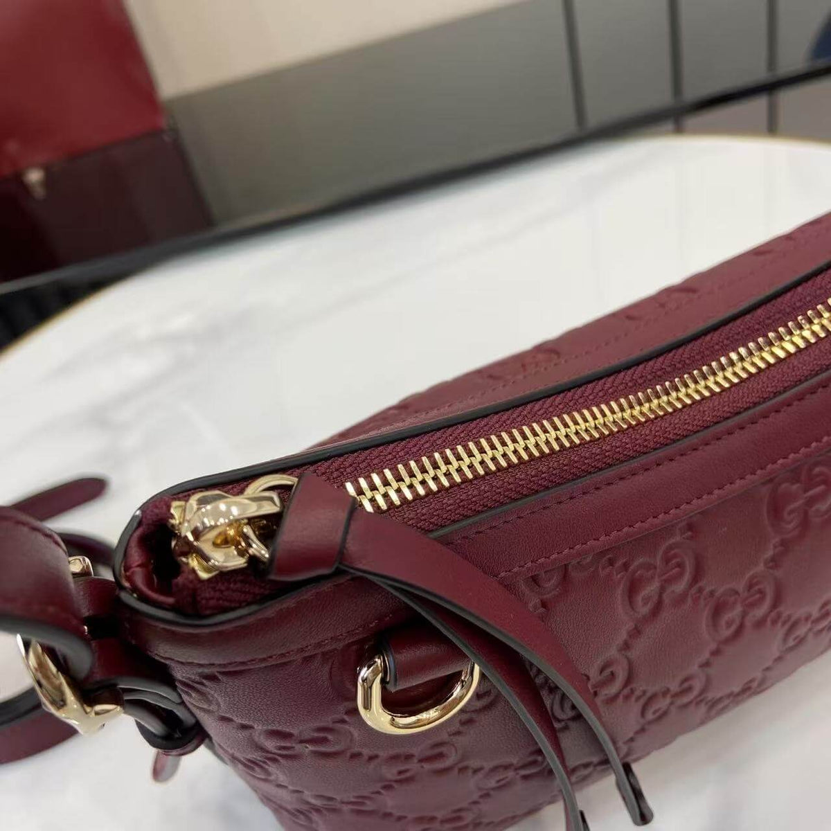Gucci Emblem Embossed