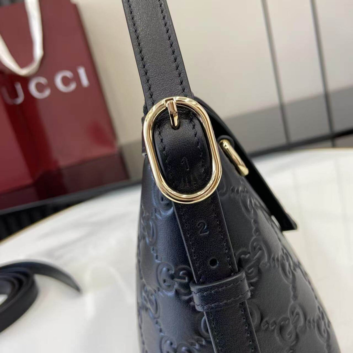 Gucci Emblem Embossed