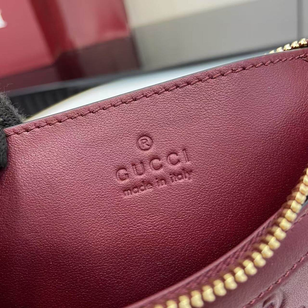 Gucci Emblem Embossed