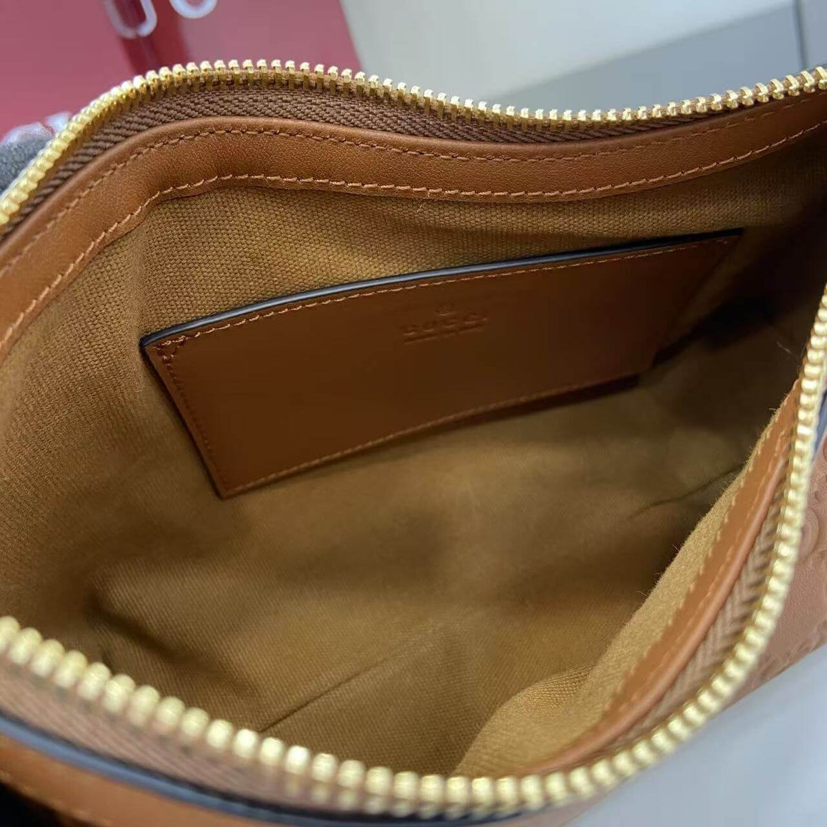 Gucci Emblem Embossed