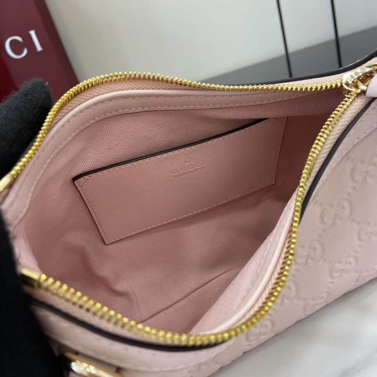 Gucci Emblem Embossed